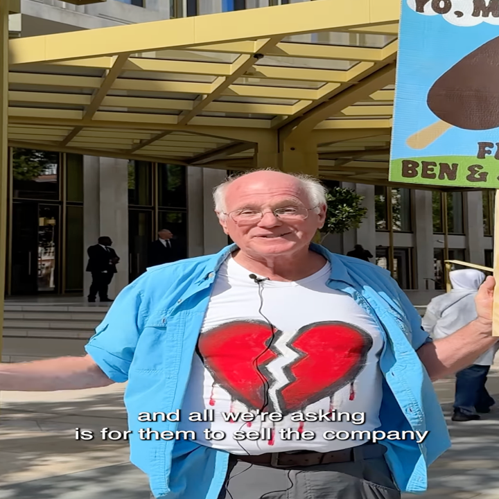 Ben Cohen of Ben &amp; Jerry's protests Magnum's stake in the company's future, wearing a shirt with a broken heart