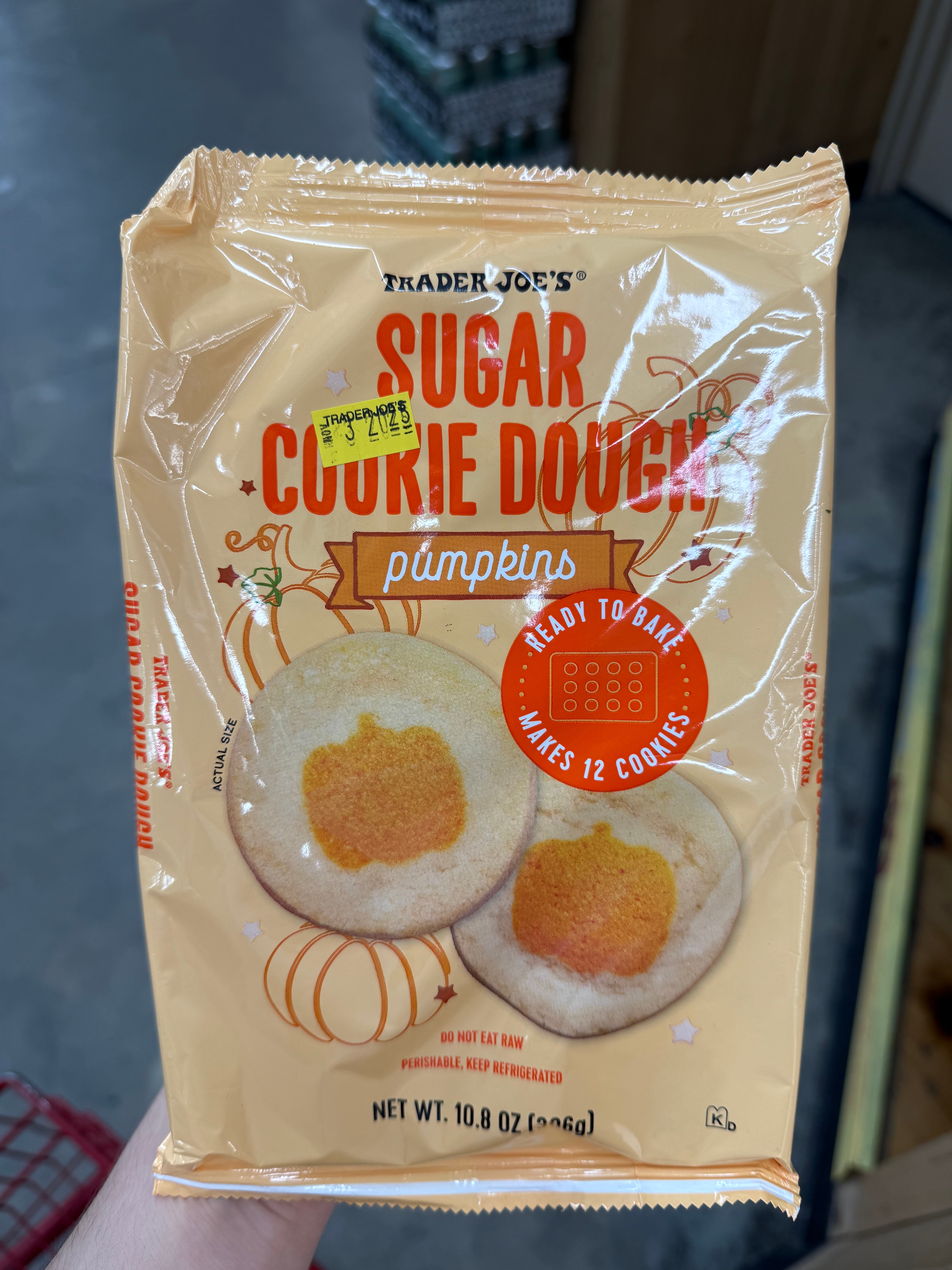 Package of Trader Joe's pumpkin sugar cookie dough, ready to bake, makes 12 cookies, net weight 10.8 oz