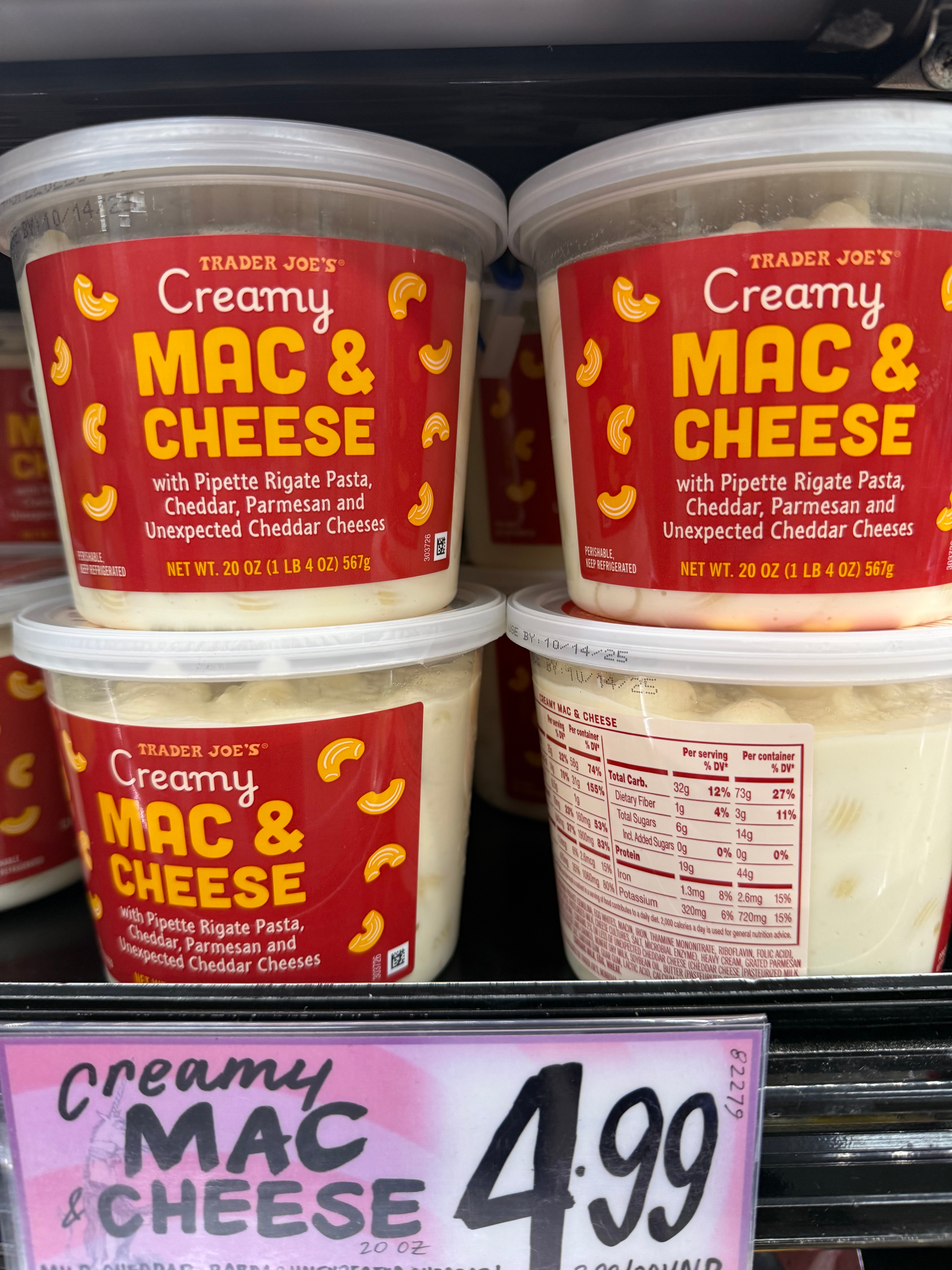 Trader Joe's Creamy Mac & Cheese containers with pipette rigate pasta, cheddar, parmesan, and unexpected cheddar cheeses, priced at $4.99