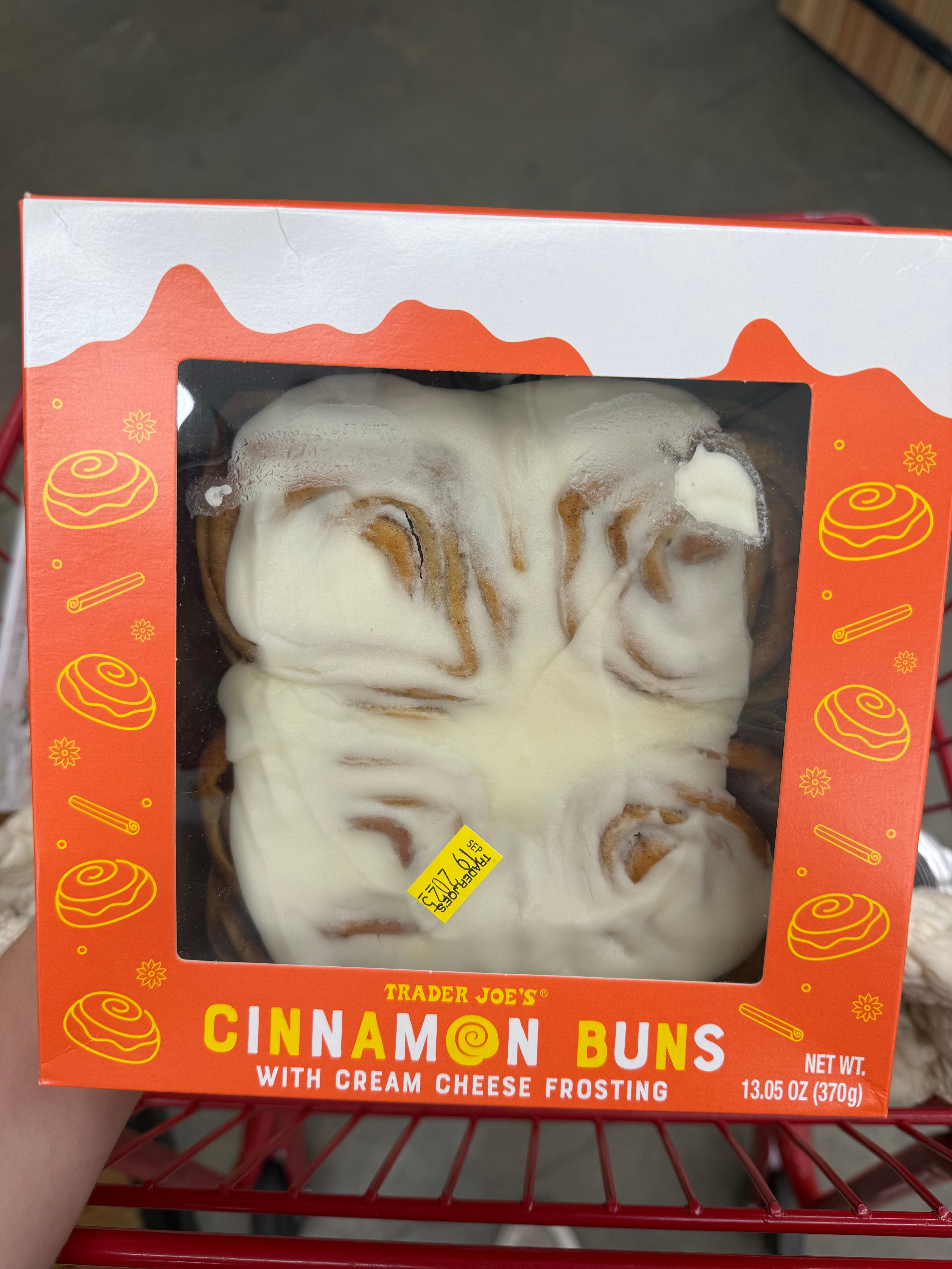 Box of Trader Joe's cinnamon buns with cream cheese frosting displayed in packaging