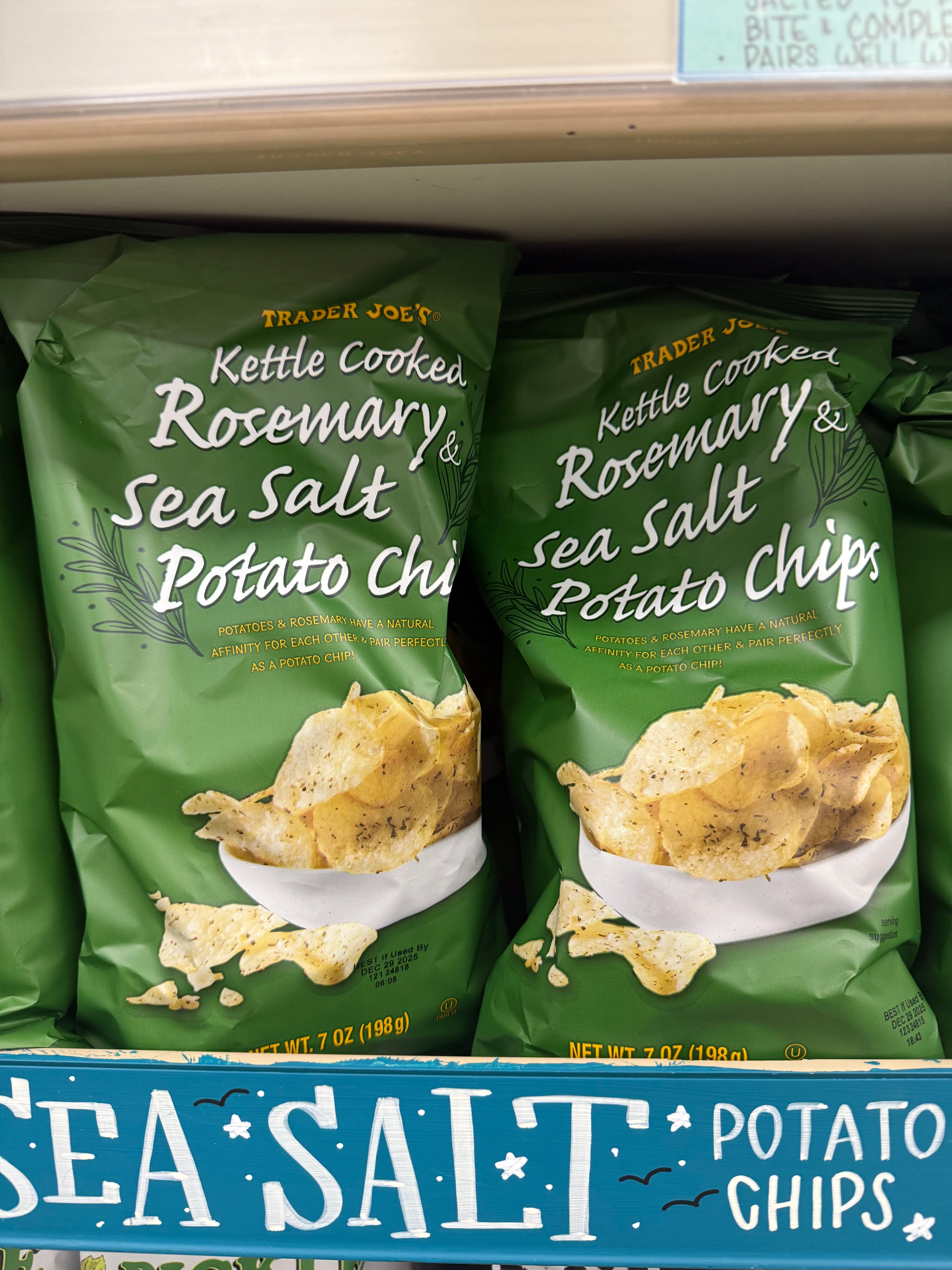 Bags of Trader Joe&#x27;s Kettle Cooked Rosemary &amp;amp; Sea Salt Potato Chips on a store shelf