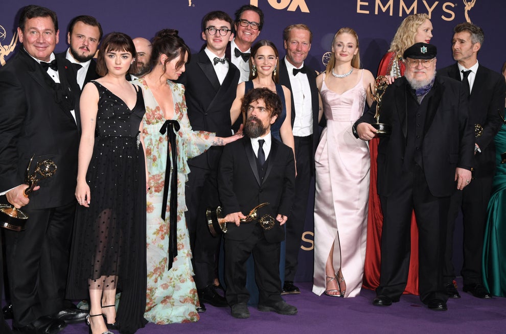 18 TV Shows That Had Some Of The Worst Endings Of All Time 8 Group of award winners posing with trophies in elegant attire at an event