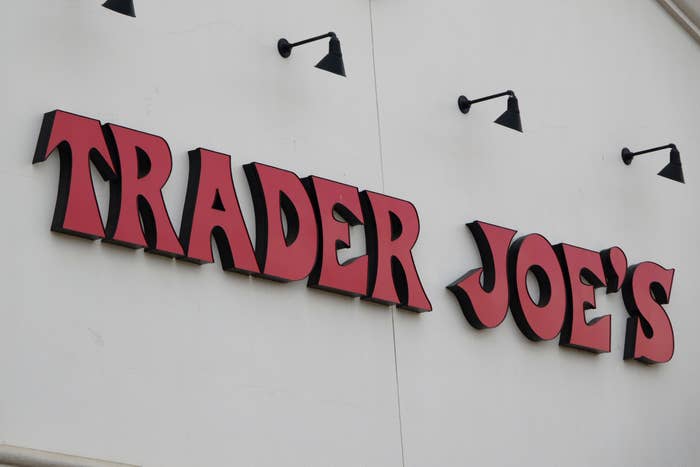 Trader Joe's storefront sign featuring large, bold letters mounted on a wall
