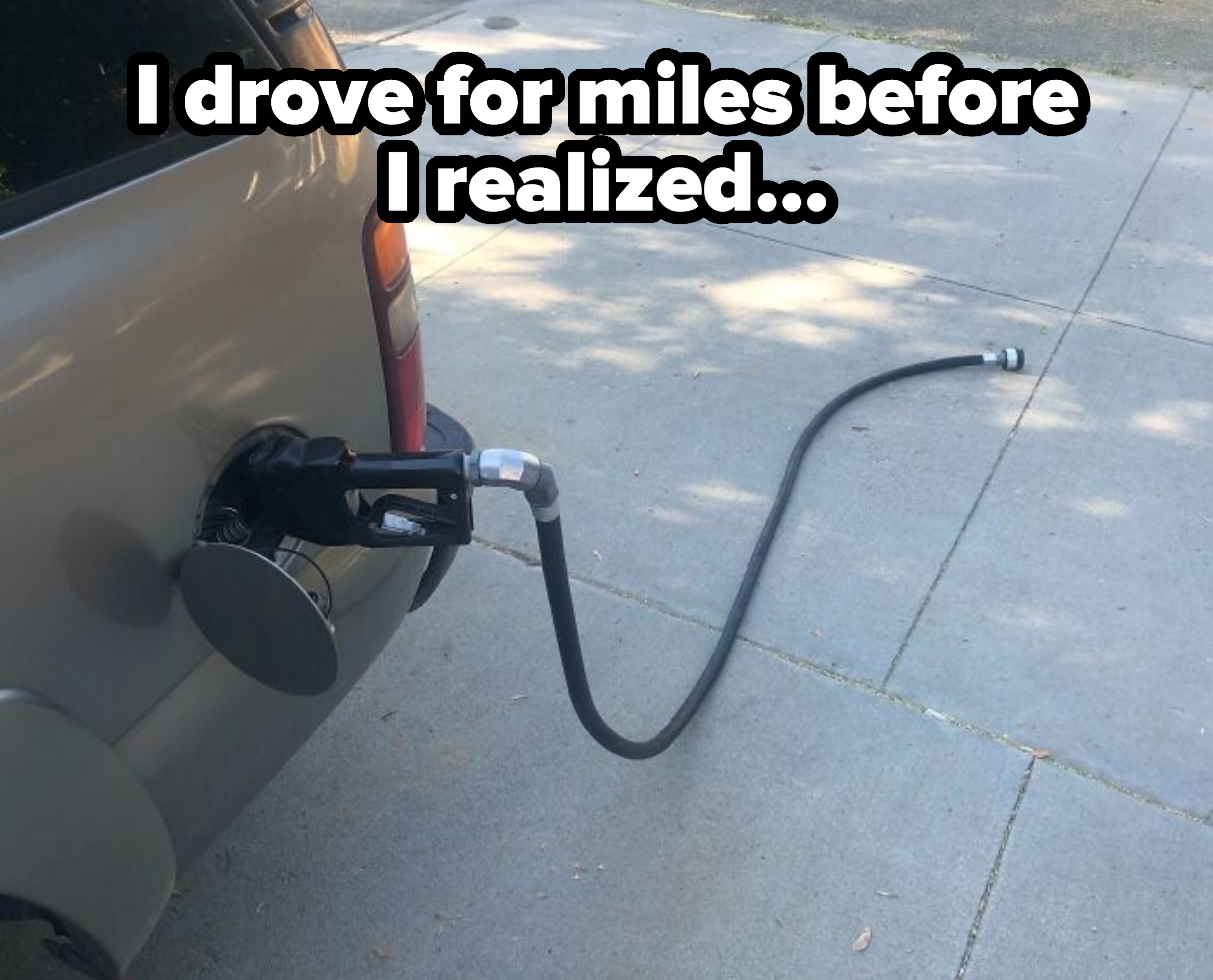 Car with a gas pump nozzle and hose still attached drives away, leaving the hose stretched on the ground