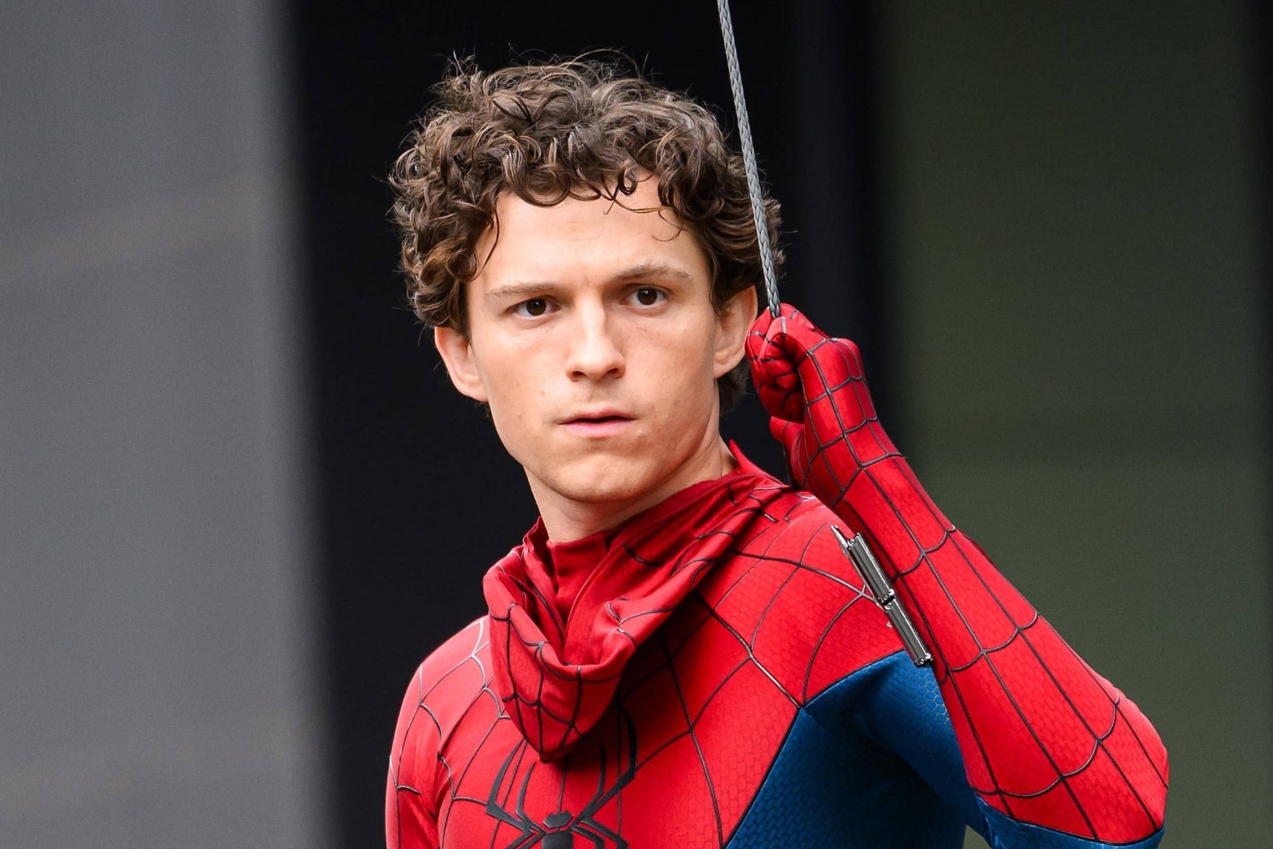 Tom Holland in a Spider-Man suit on set