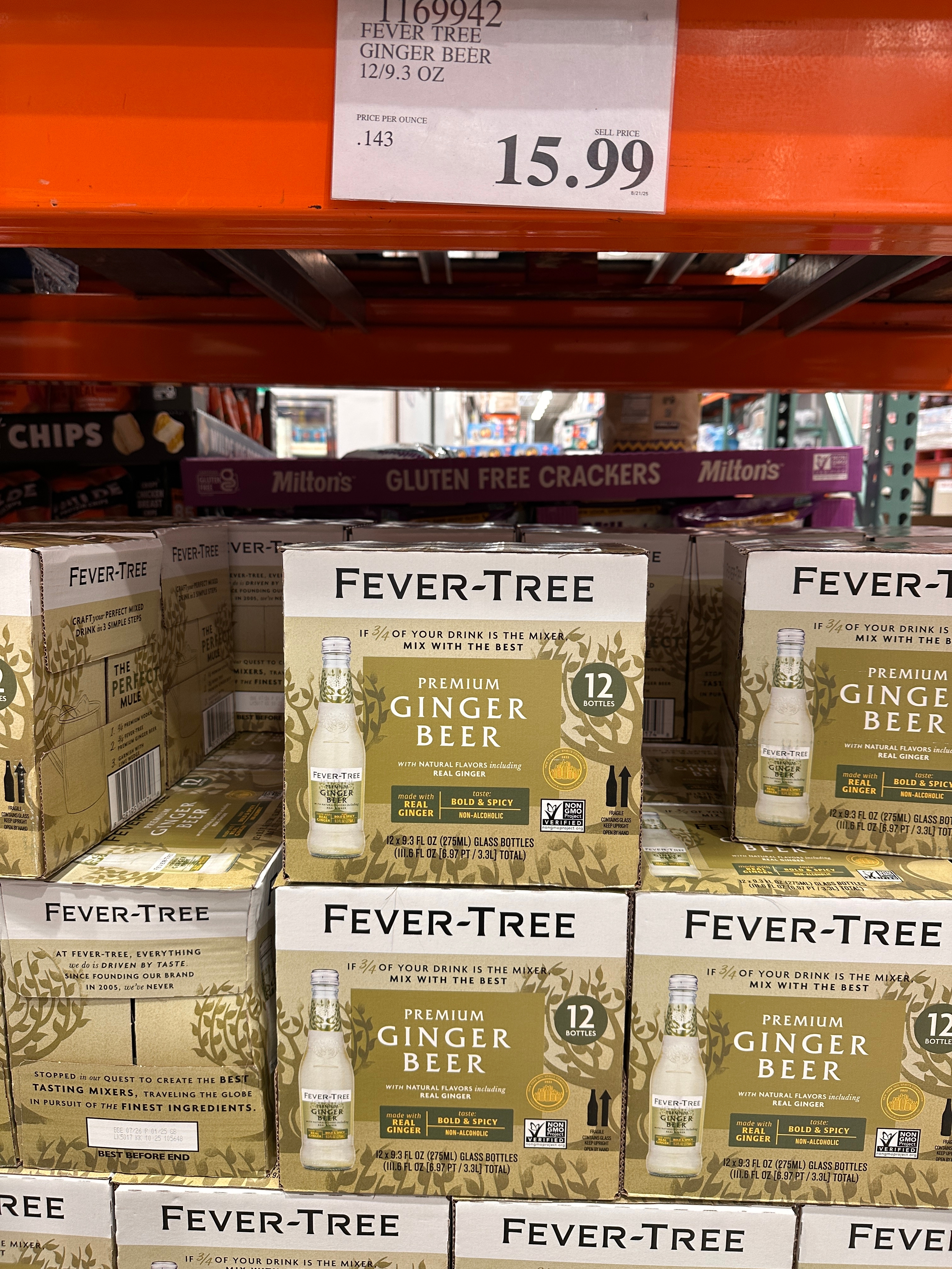 Fever-Tree Premium Ginger Beer packs stacked on a supermarket shelf, priced at $15.99 for a 12-pack