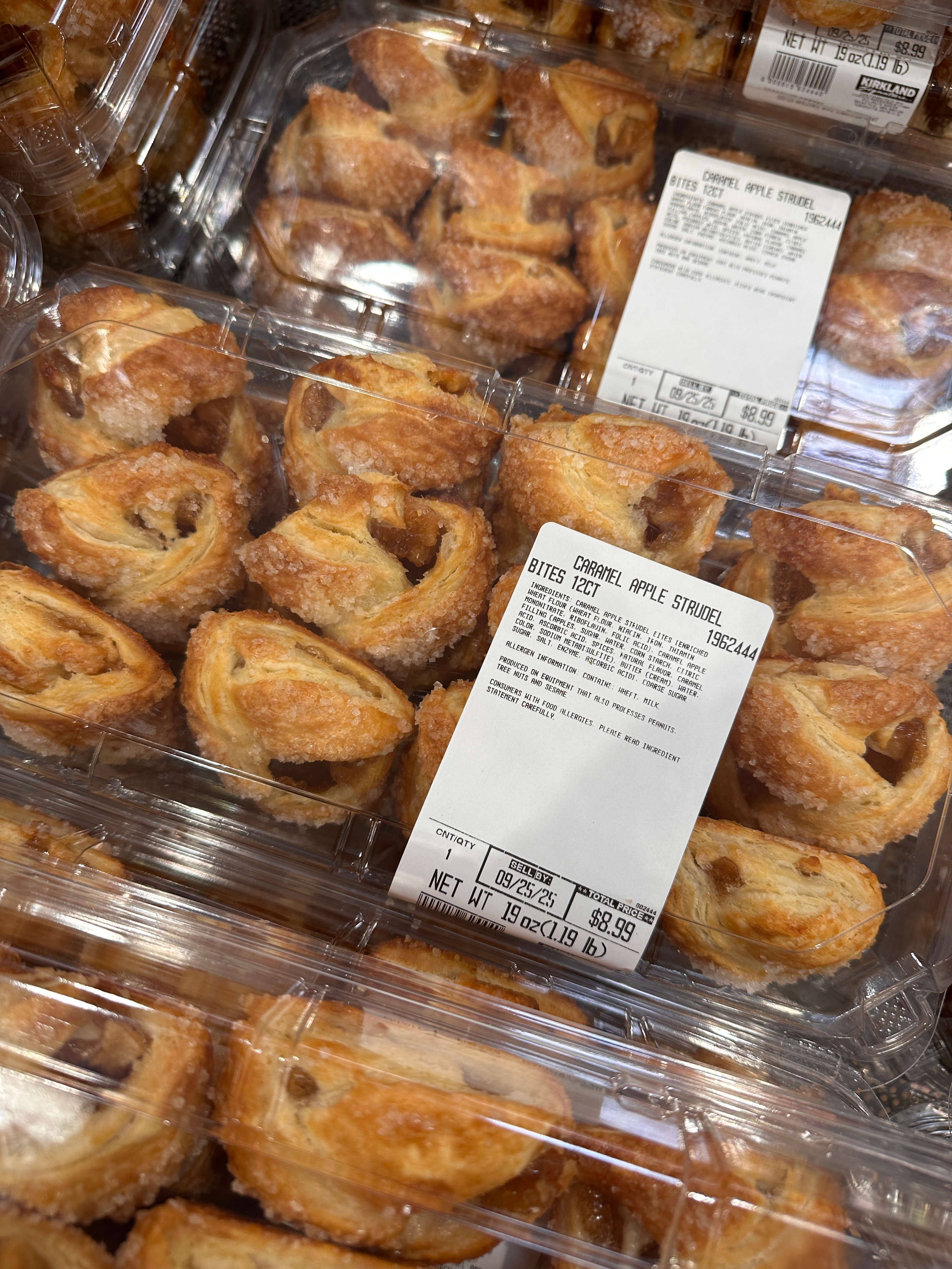 Plastic containers filled with bite-sized apple strudels, labeled with nutritional information
