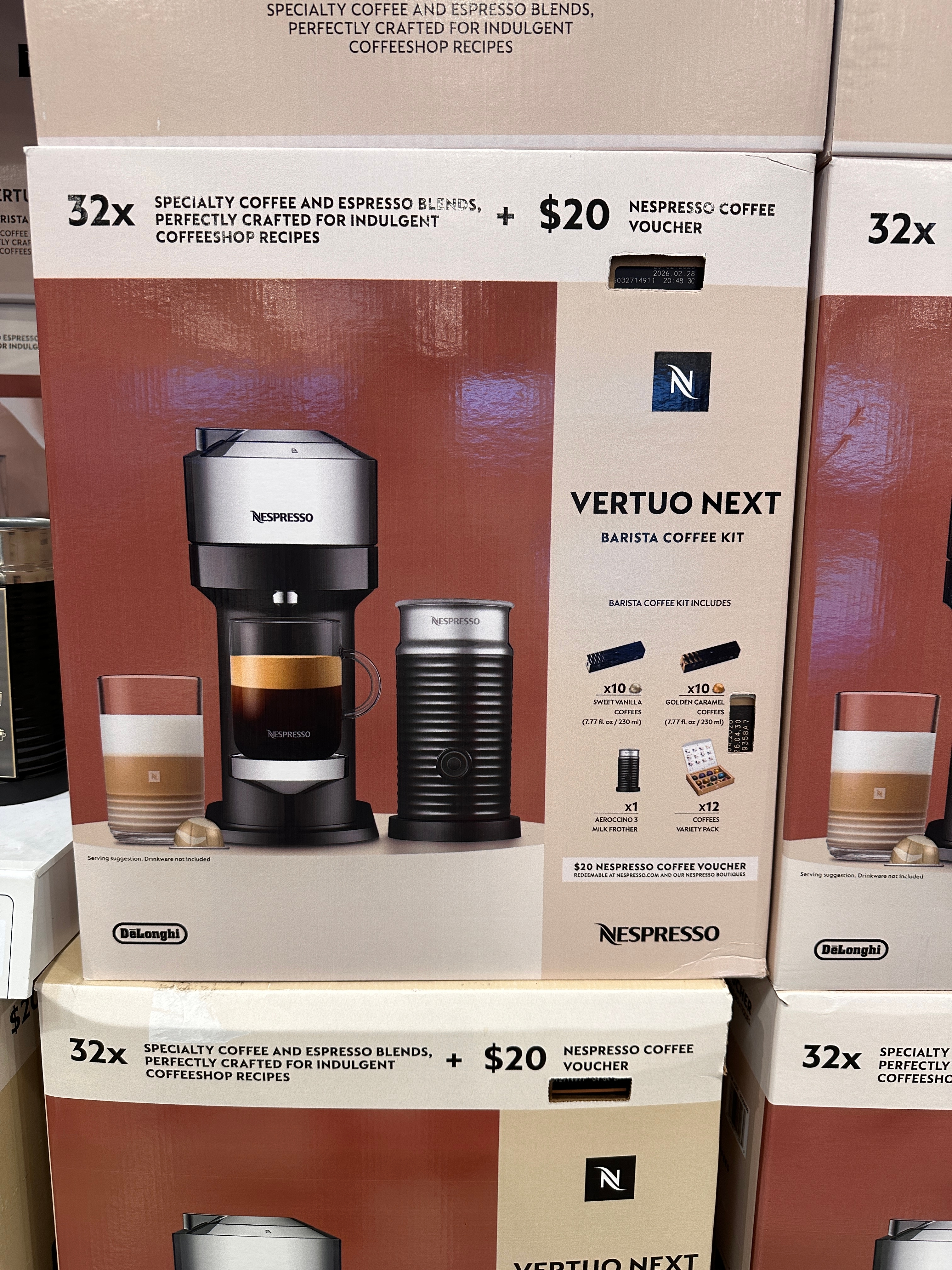 Nespresso Vertuo Next Barista Coffee Kit in box with 32 coffee pods and $20 coffee voucher. Includes coffee machine and milk frother