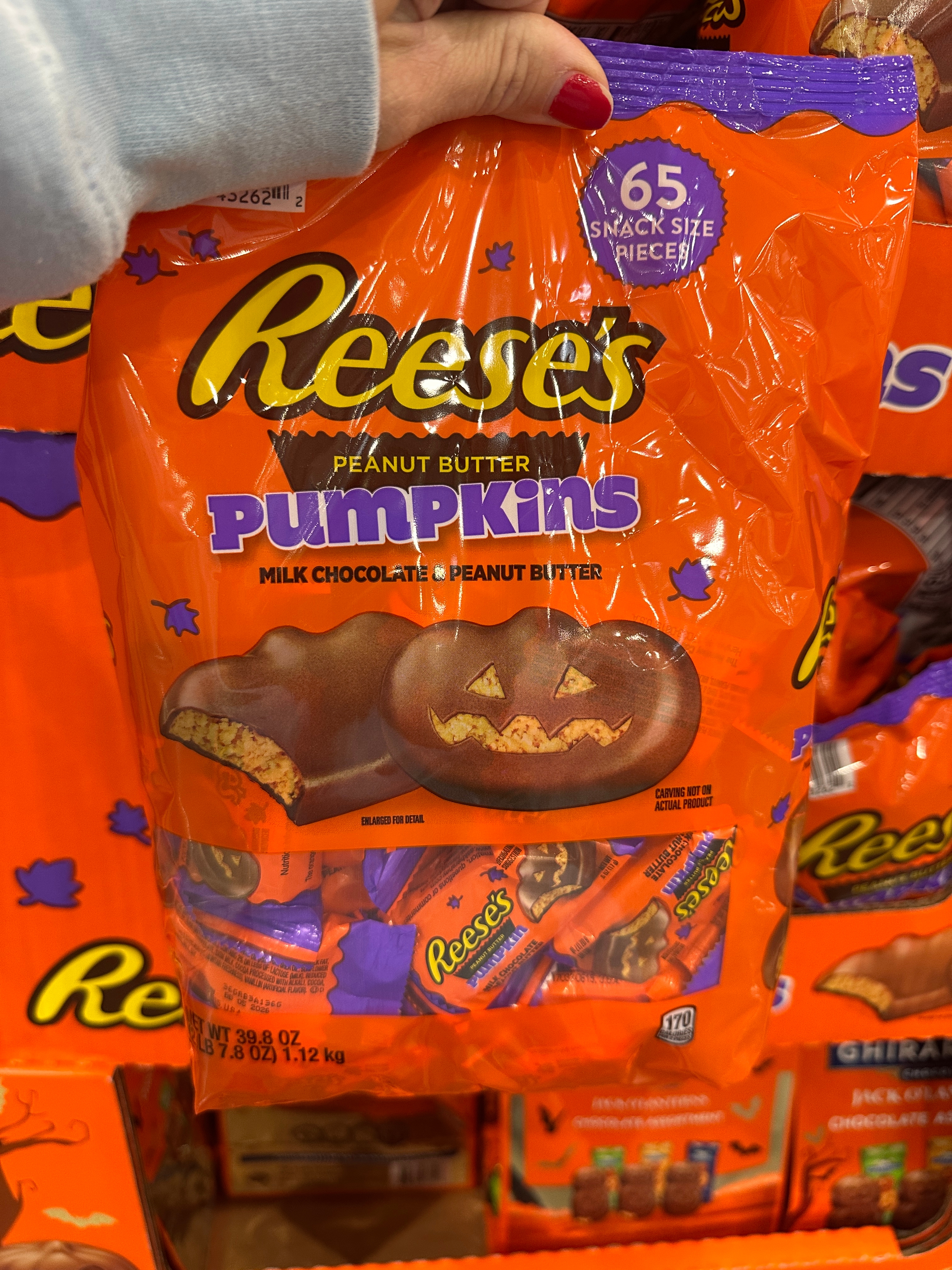 A pack of Reese's Peanut Butter Pumpkins with a Halloween-themed design