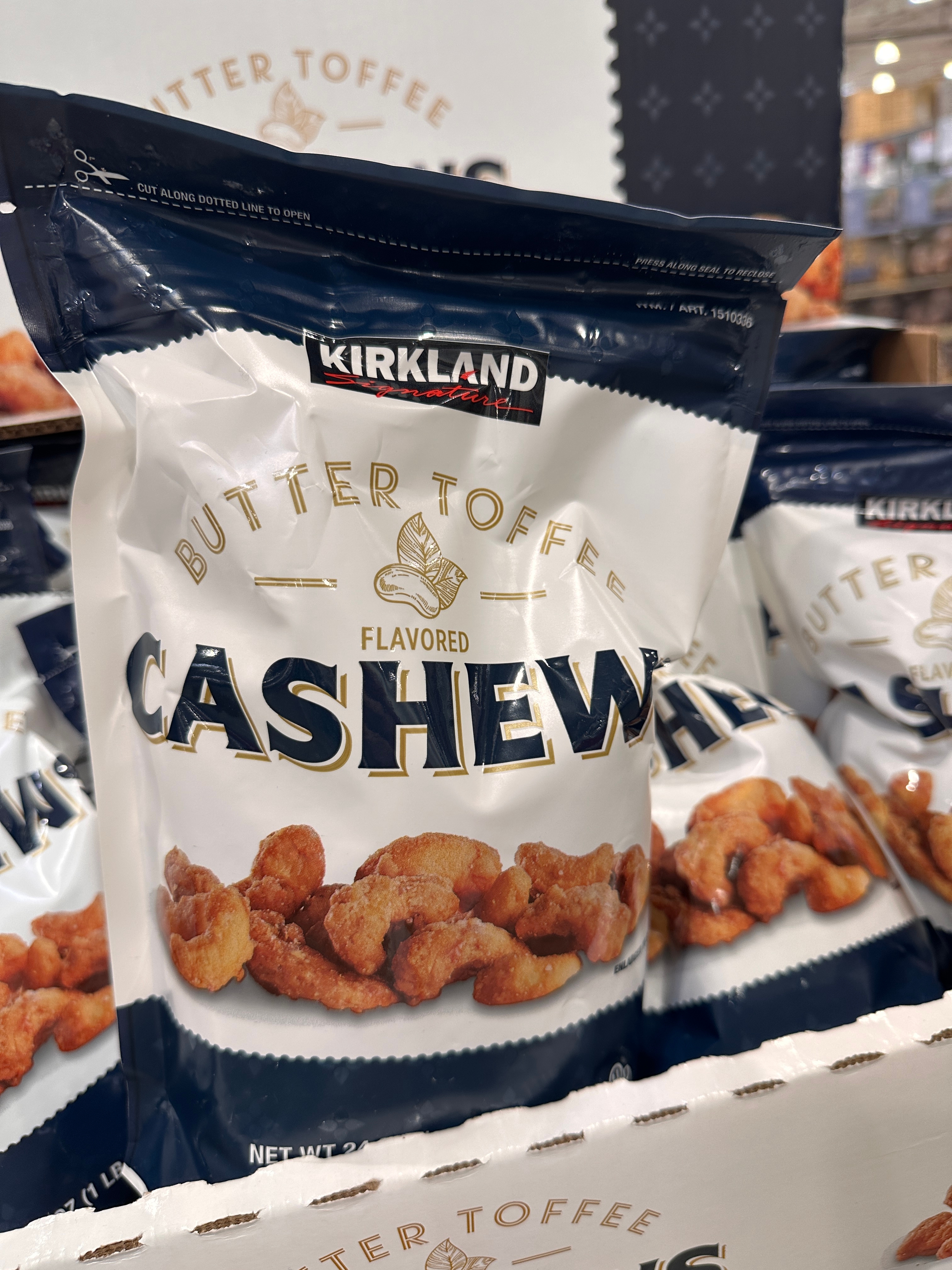 Bag of Kirkland Signature Butter Toffee Cashews displayed in a store