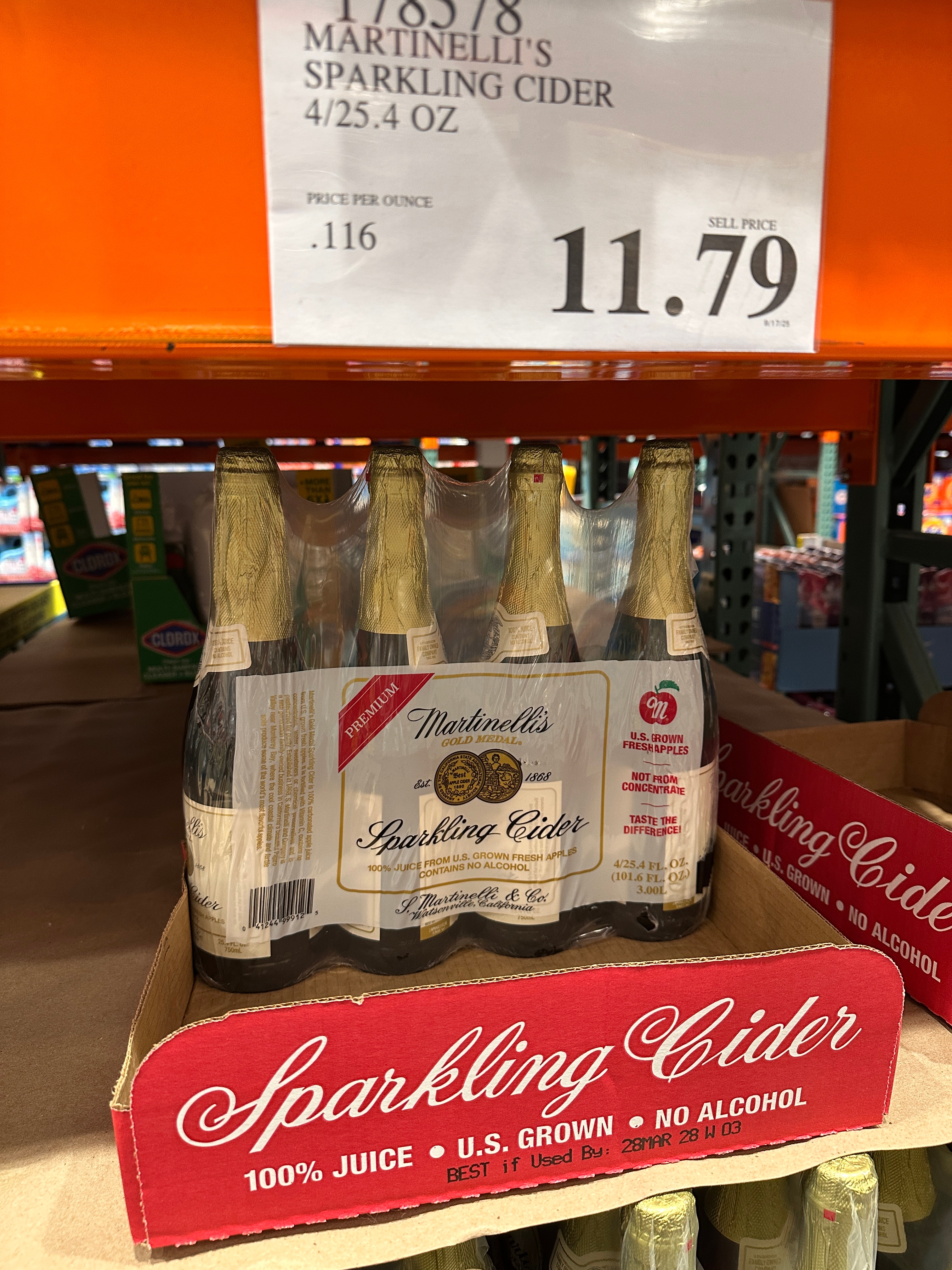 Store display of Martinelli's Sparkling Cider, a 4-pack priced at $11.79, labeled as 100% juice, U.S. grown, and alcohol-free