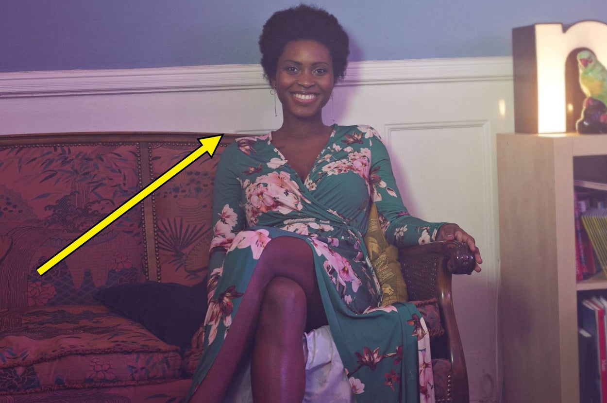 A person wearing a stylish lace-up top gestures expressively, with a playful and engaging expression