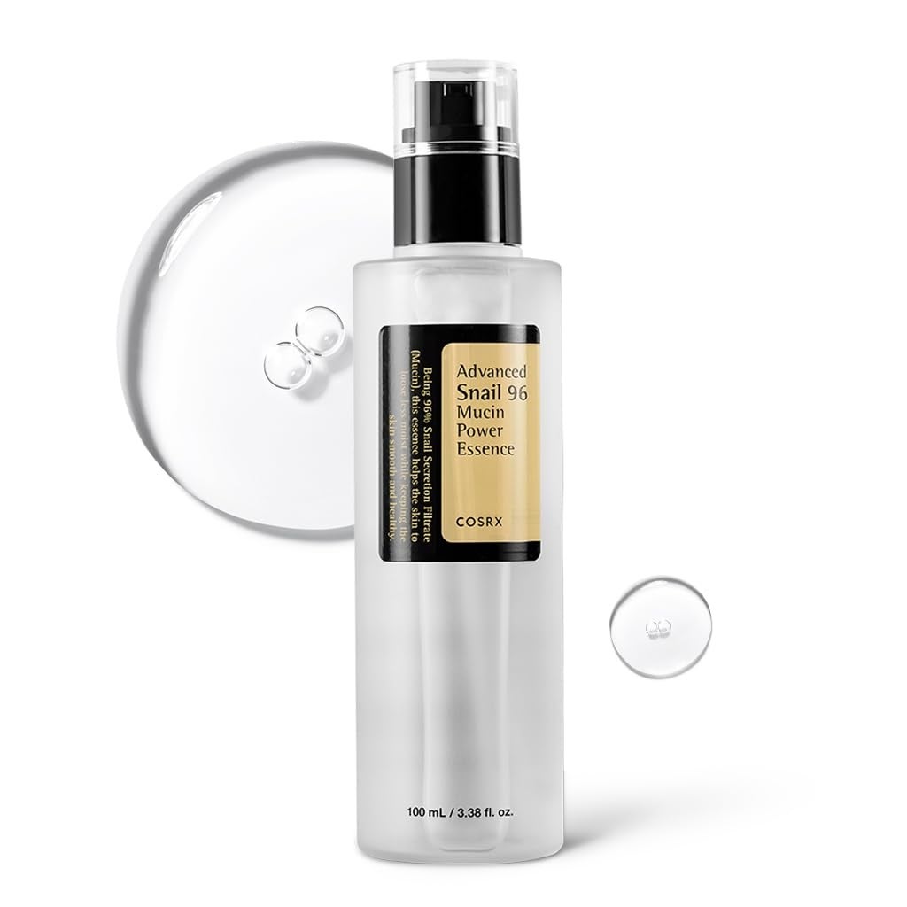 Cosrx Advanced Snail 96 Mucin Power Essence bottle with clear liquid droplets nearby. Skincare product for hydration and skin texture