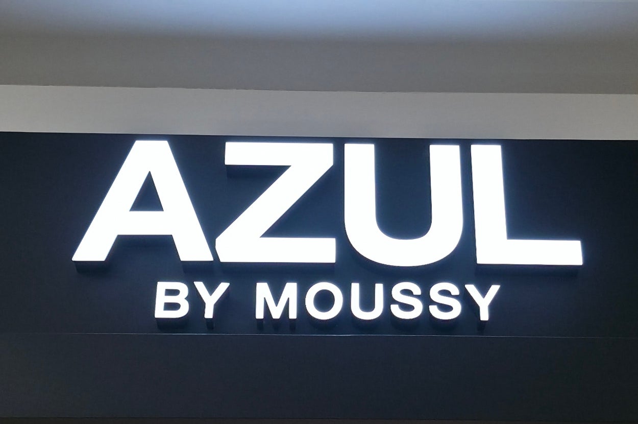 Store sign: "AZUL BY MOUSSY" displayed on a sleek black background inside a mall setting