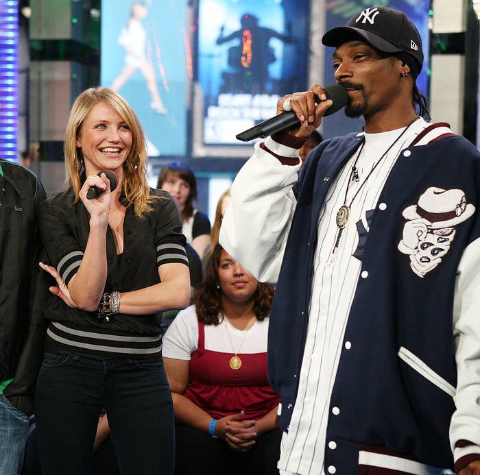 24 Bizarre Celeb Facts That Sound Fake, But Are 100% True 4 Three people are on stage; one is wearing a casual jacket and cap, another has a striped top and jeans, and the third wears a sports jacket and cap