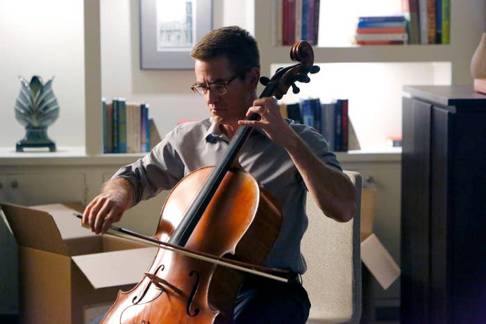 24 Bizarre Celeb Facts That Sound Fake, But Are 100% True 2 Person playing a cello in a home setting, surrounded by books and unpacked boxes