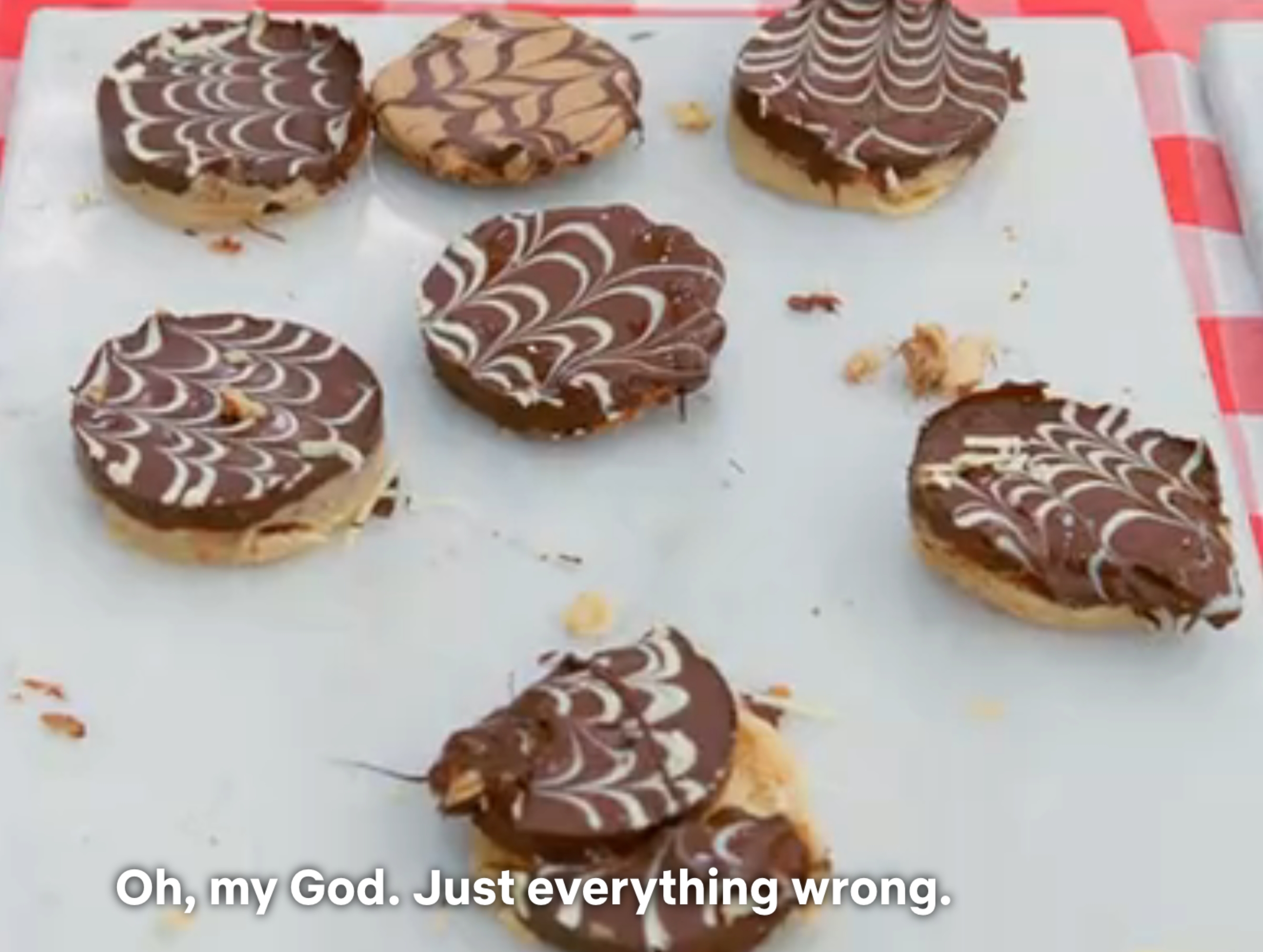 A tray of cookies with marbled chocolate tops. Caption at bottom: "Oh, my God. Just everything wrong."