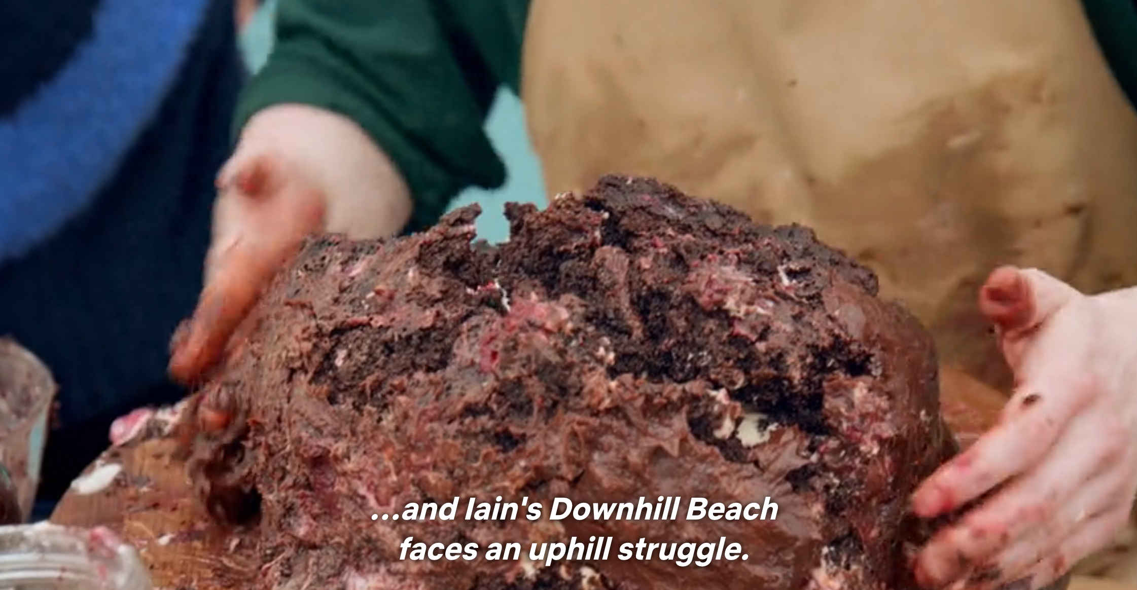 A failed cake attempt on a baking show is shown with the caption, "...and Iain's Downhill Beach faces an uphill struggle."