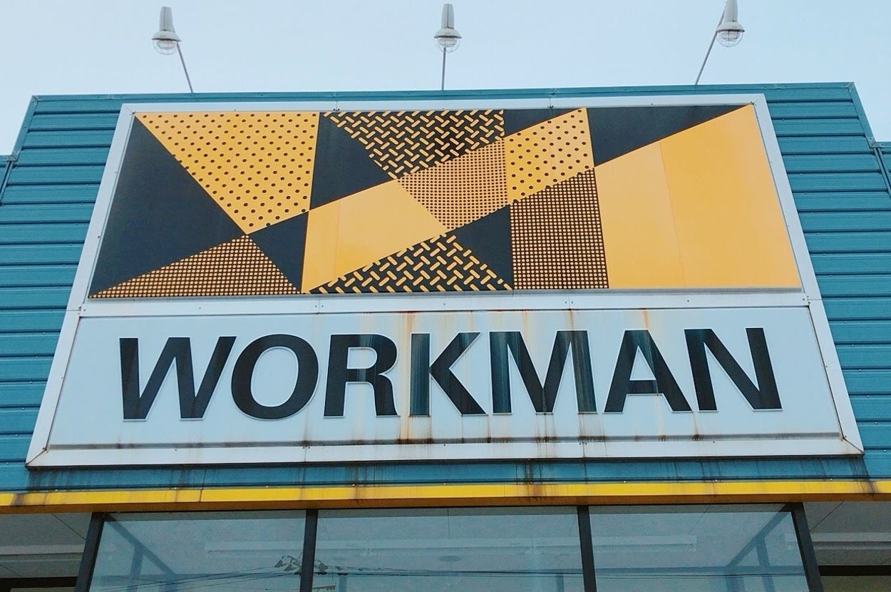 The "WORKMAN" store facade with a geometric patterned sign above the entrance