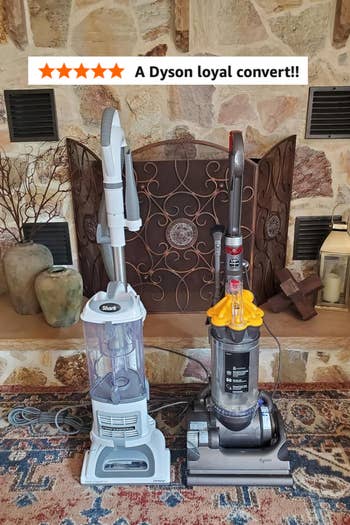 Two vacuum cleaners connected a decorative rug successful beforehand of a chromatic fireplace, with vases and a lantern to the side