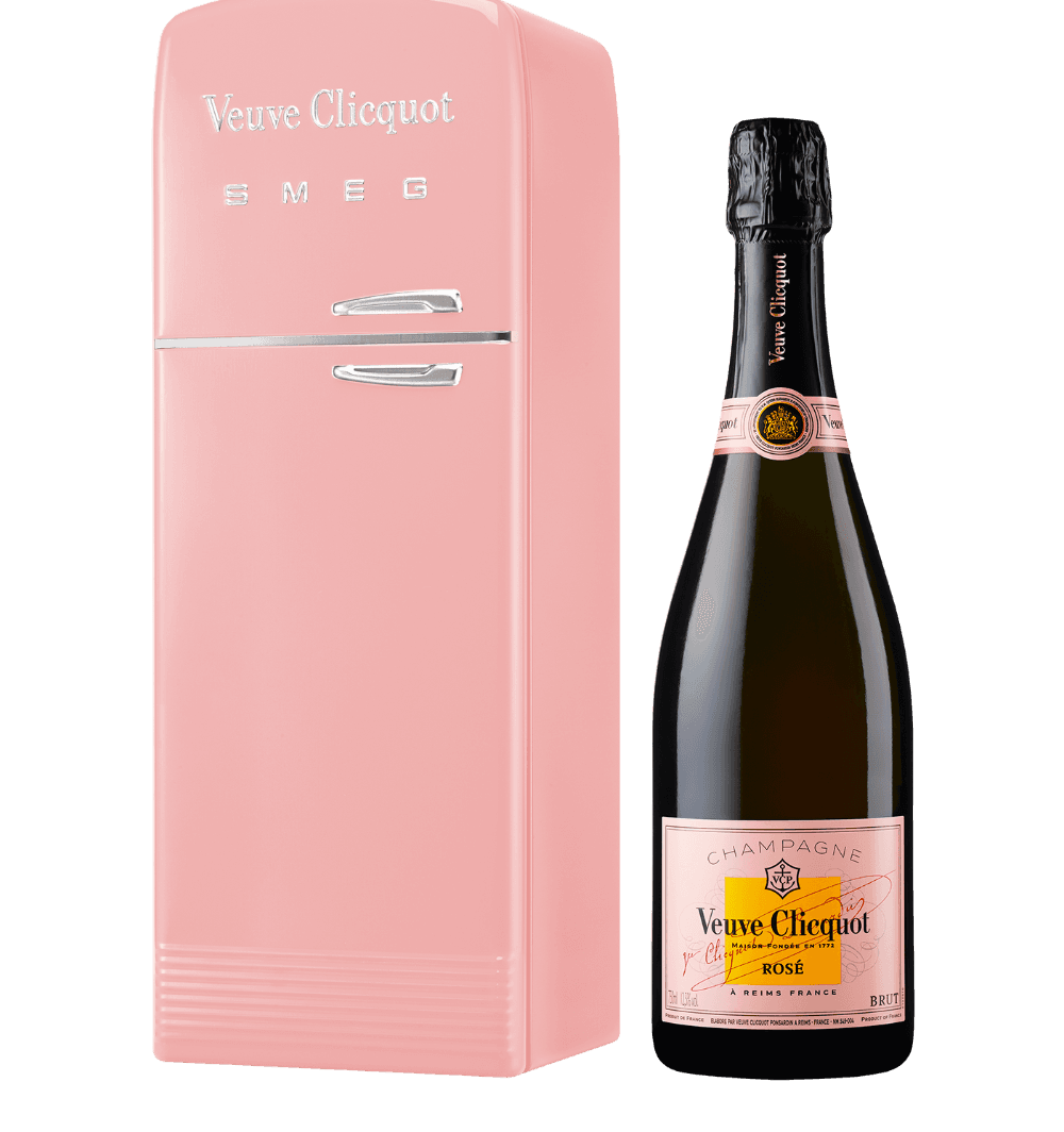 Mini pink Smeg fridge with Veuve Clicquot logo next to a bottle of Veuve Clicquot Rosé Champagne