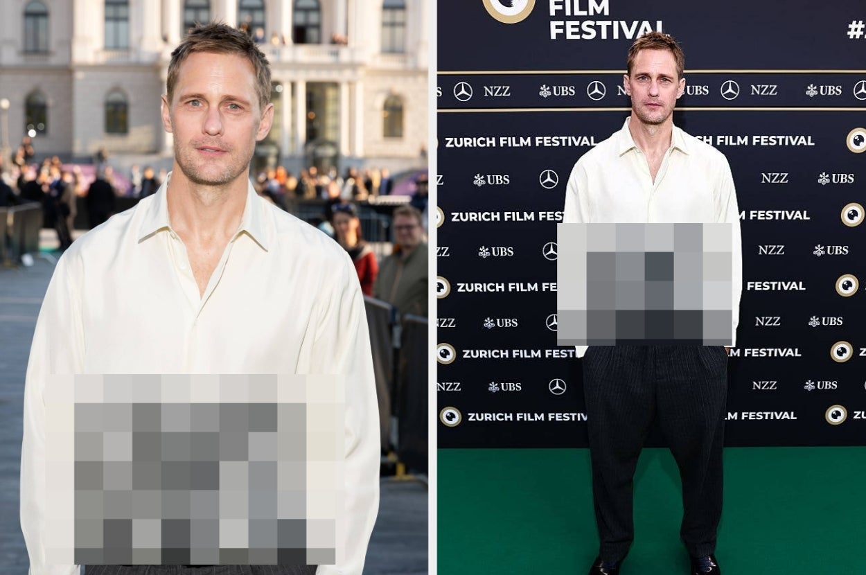 Man in a loose white shirt and dark trousers on a red carpet at a film festival
