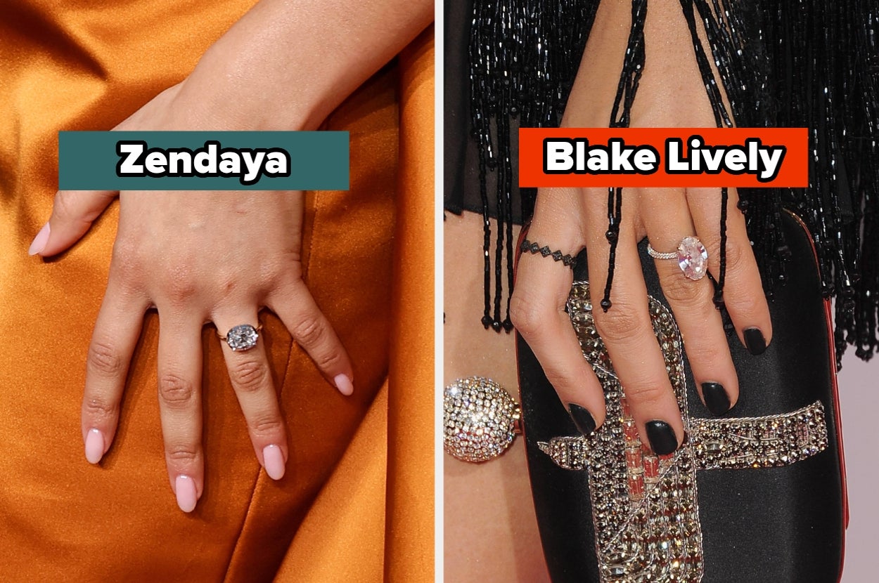 Two hands showing engagement rings. One hand has a simple pink nail design, the other has a bold black nail design with intricate jewelry