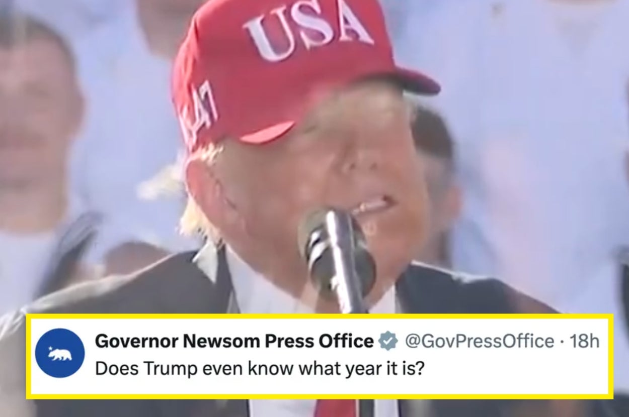 A person wearing a "USA" cap speaks at a rally. Text overlay: "Governor Newsom Press Office: Does Trump even know what year it is?"