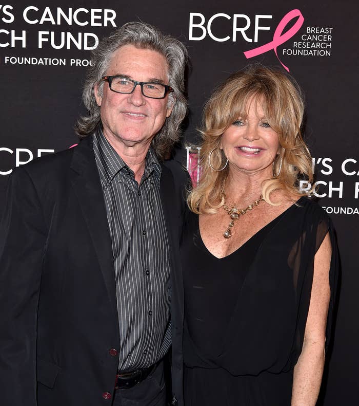 After A Viral Post About Goldie Hawn And Kurt Russell Sparked Interesting Marriage Discourse, Here Are More Unmarried Celeb Couples Who Have Been Together For A Long, Long Time 2 Kurt Russell and Goldie Hawn smiling at an event