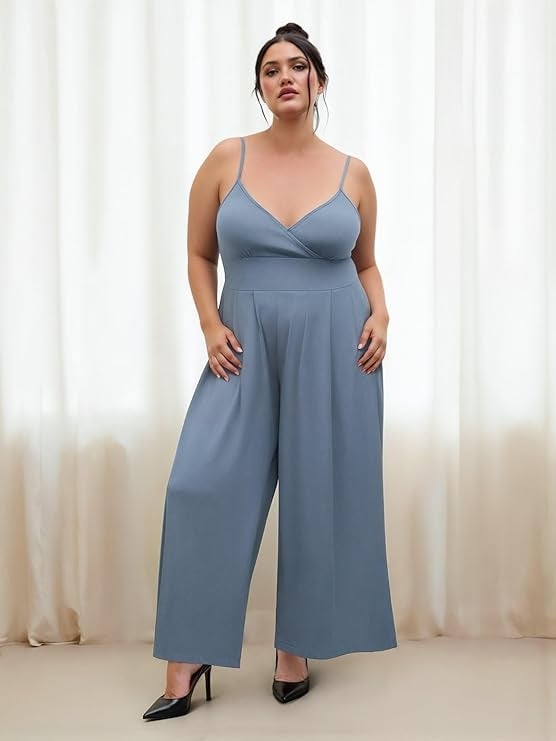 model successful  a stylish sleeveless jumpsuit with wide   legs, posing against a curtain backdrop, wearing achromatic  heels
