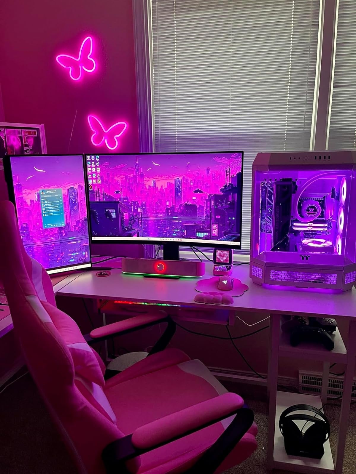 Futuristic gaming setup with dual monitors, neon butterfly lights, and glowing PC case, perfect  for tech enthusiasts seeking immersive experiences