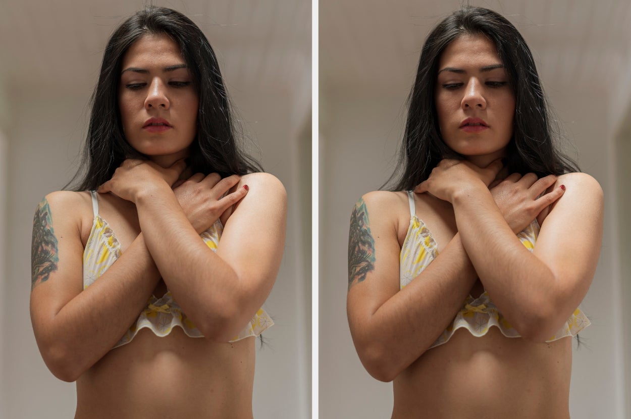 Person with long hair in a sleeveless top stands with hands clasped around neck, conveying a contemplative mood