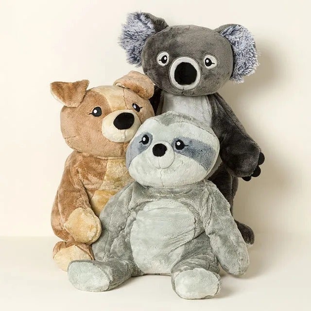 Three plush toys (koala, dog, and sloth) sitting together, cleanable   for a cozy and playful acquisition  option