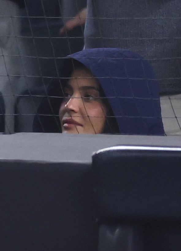 Kylie Jenner with a neutral expression while watching a Yankees game