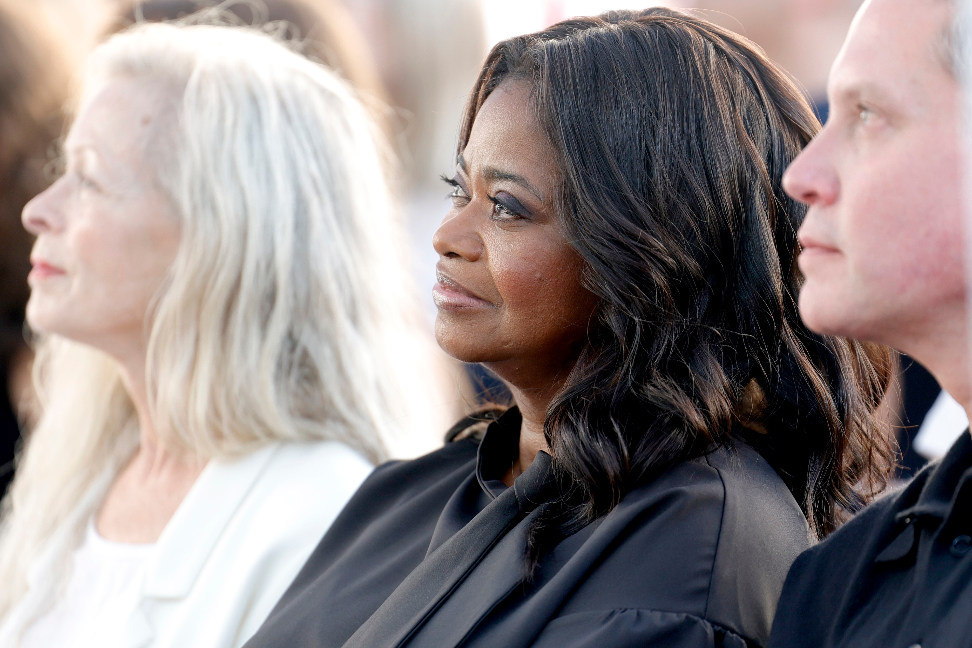 Octavia Spencer seated with wavy hair