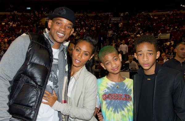 Will, Willow, Jaden, and Jada Pinkett smith courtside at a basketball game