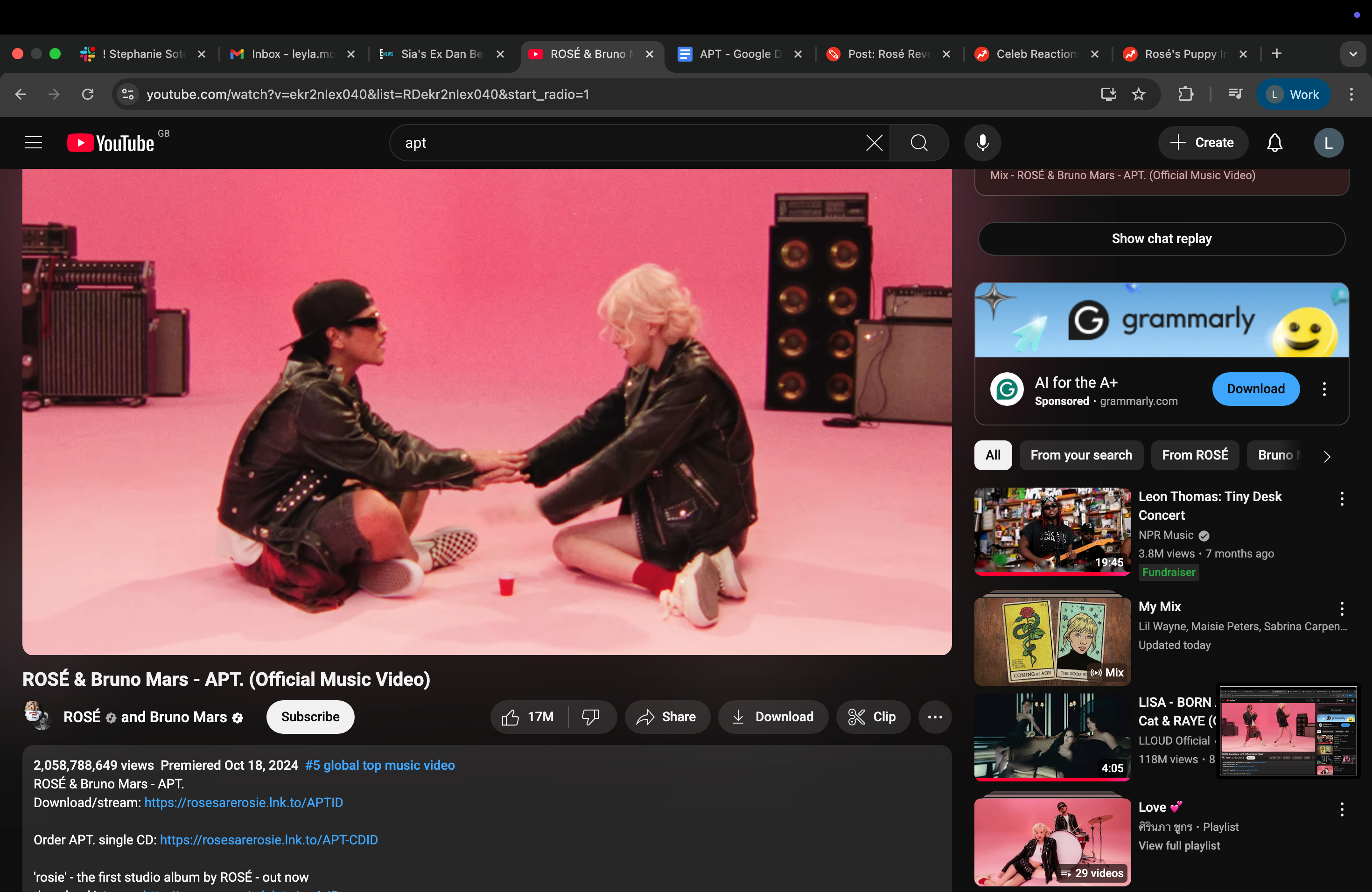 Bruno and Rosé sitting and facing each other with their hands stacked, playing a drinking game