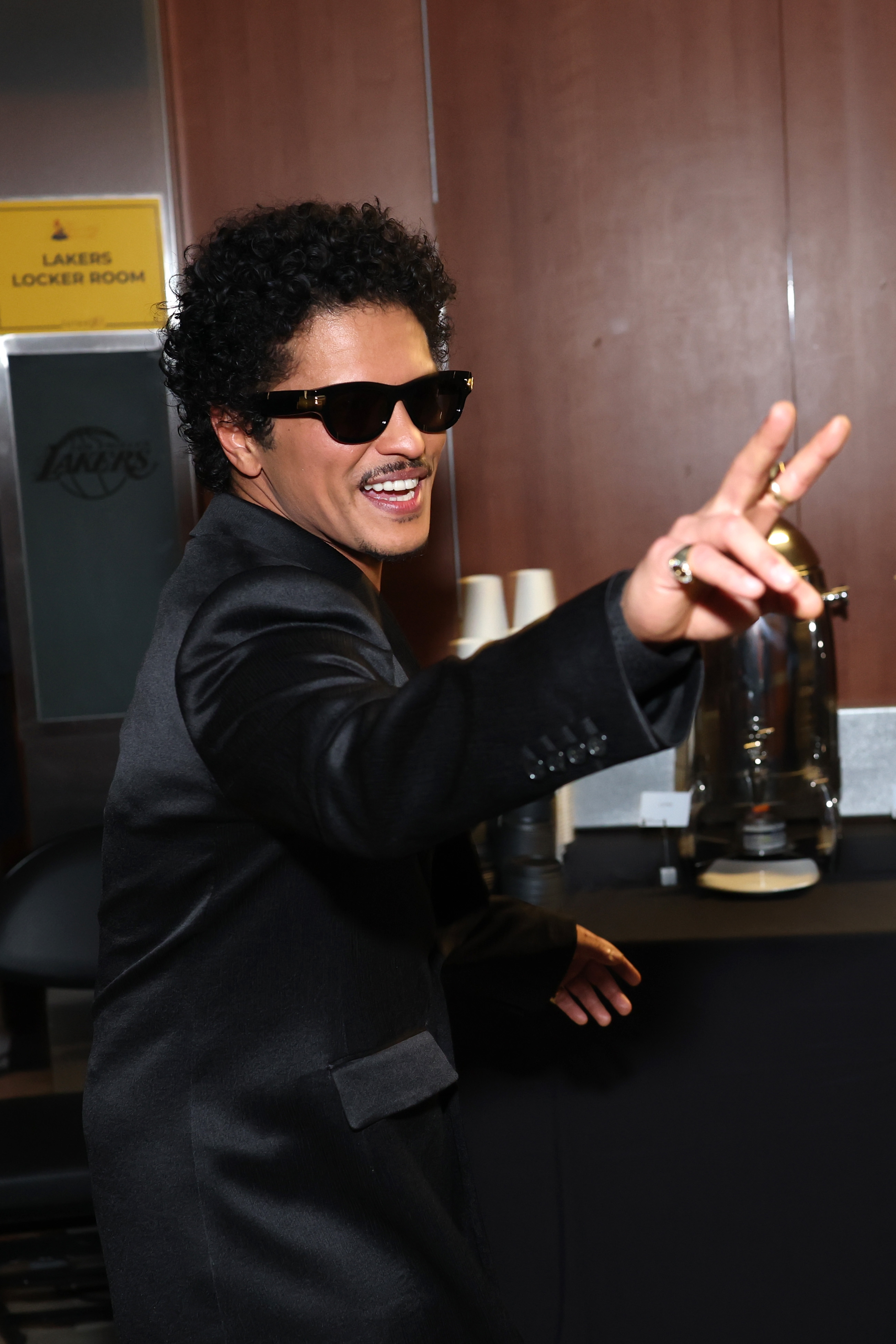 Bruno Mars making a peace sign