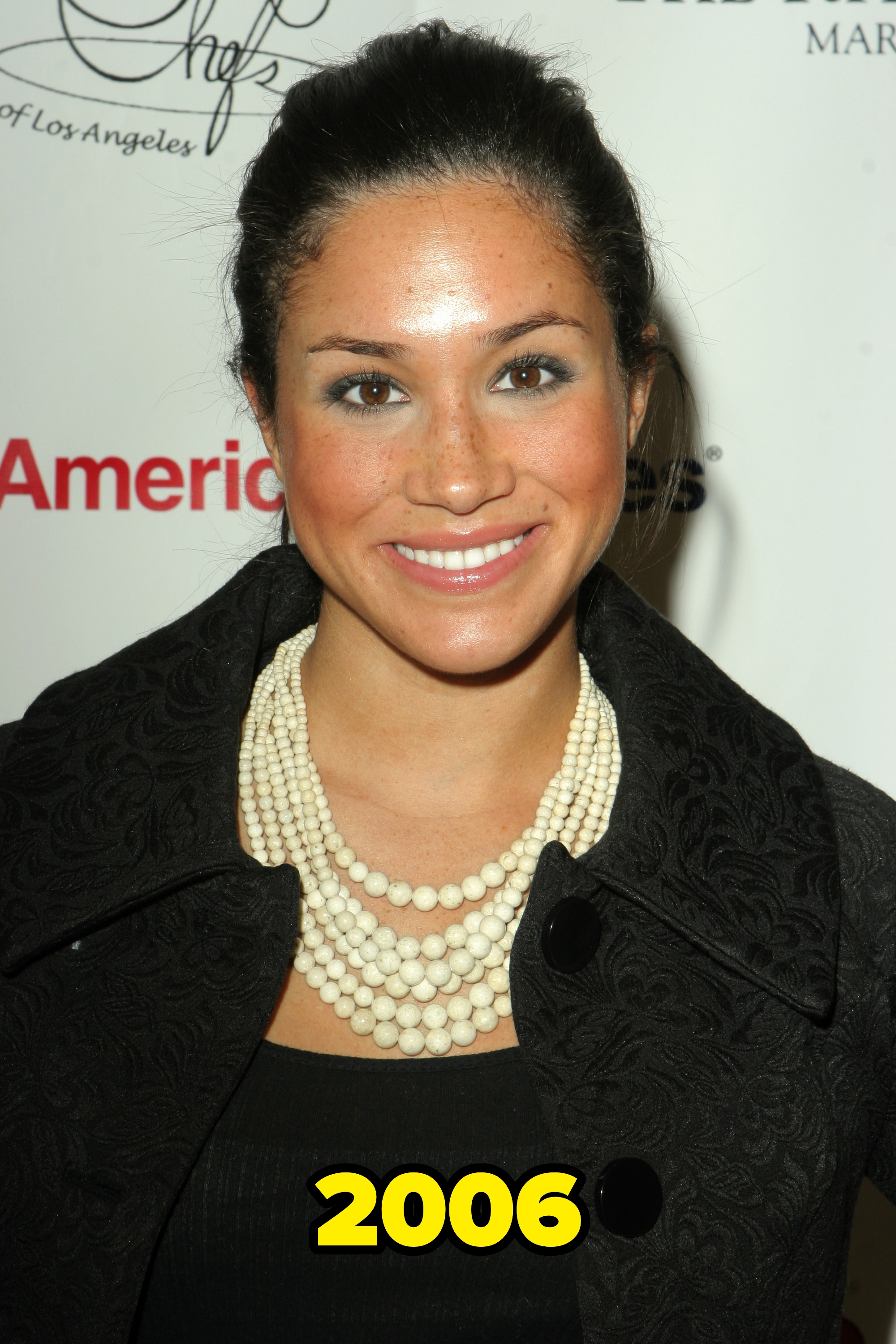 Meghan Markle smiling at a 2006 event