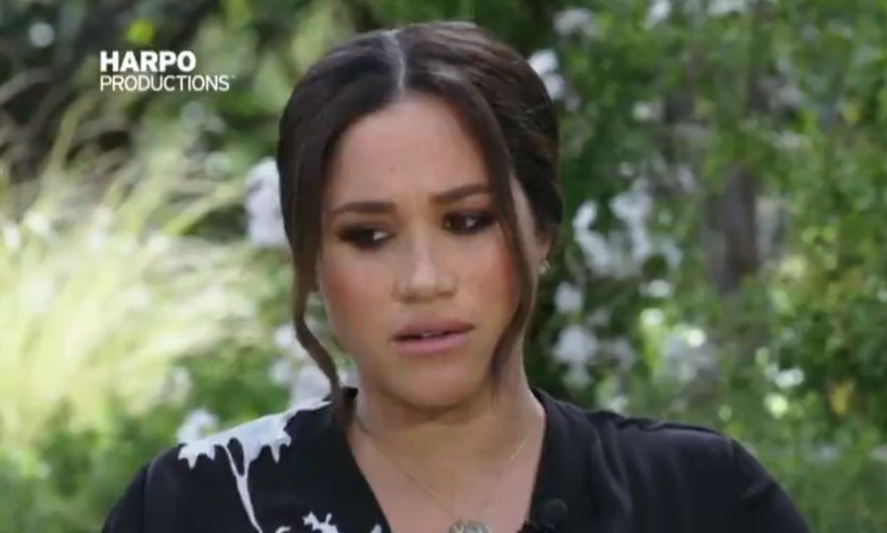 21 Low-Key Ridiculous Things Celebs Did For Money, Clout, Or Attention 84 A close up of a woman with her dark hair pulled back into a bun is in mid sentence while seated
