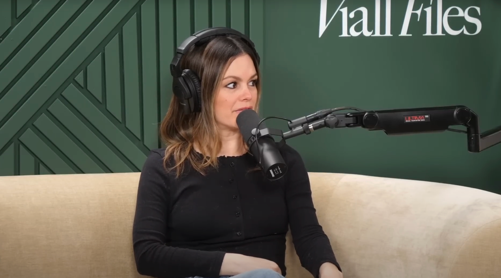 21 Low-Key Ridiculous Things Celebs Did For Money, Clout, Or Attention 78 Rachel seated and wearing headphones, speaking into her giant mic