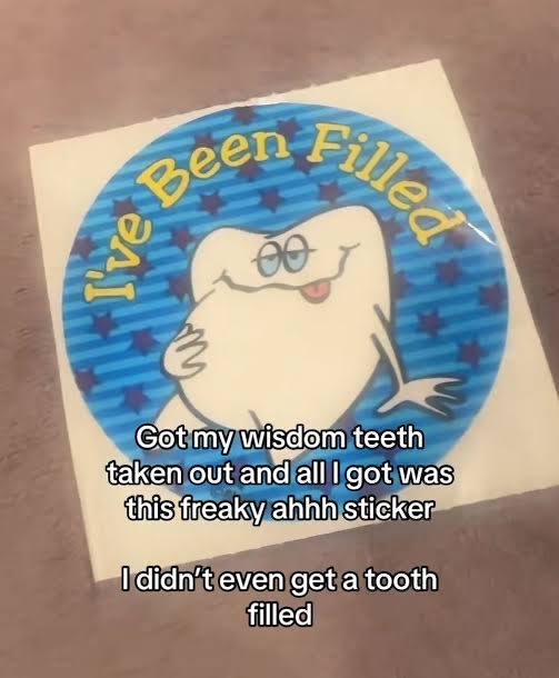 Cartoon tooth sticker reads &quot;I&#x27;ve Been Filled.&quot; Text below jokes about getting wisdom teeth out and only receiving the sticker, not a tooth filling