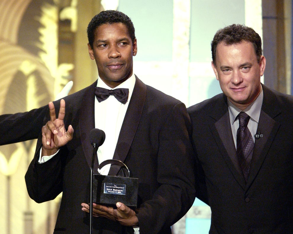 21 Jaw-Dropping "Then And Now" Photos Of Celebrities Who Have Gotten Wayyyyy Sexier With Age 52 One is in a tuxedo and holding an award, while the other is in a suit, both are standing at a microphone