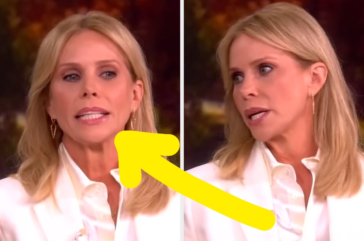 Person with long hair in a white blazer and blouse appears to speak and react in a split-screen TV interview