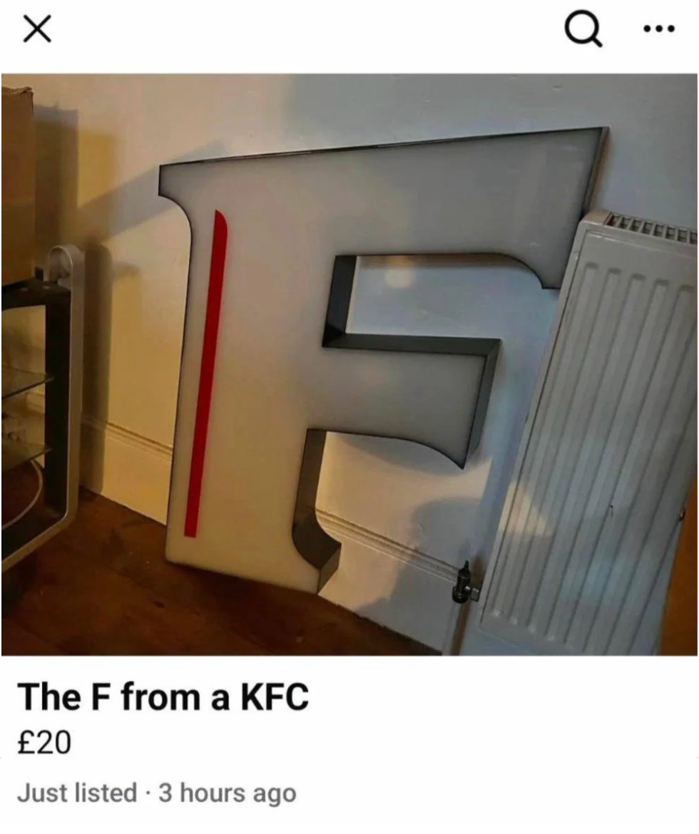 Large letter &quot;F&quot; sign leaning against a wall, listed for sale at £20, described as from a KFC