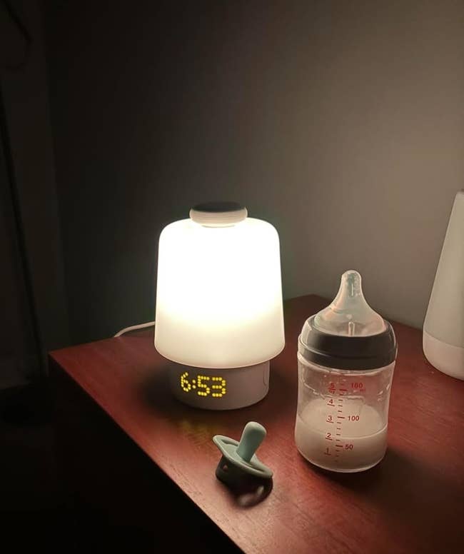 53, a babe vessel with milk, and a pacifier