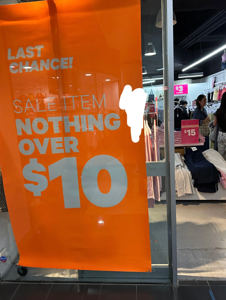 Storefront sign reads: "LAST CHANCE! SALE ITEM NOTHING OVER $10."