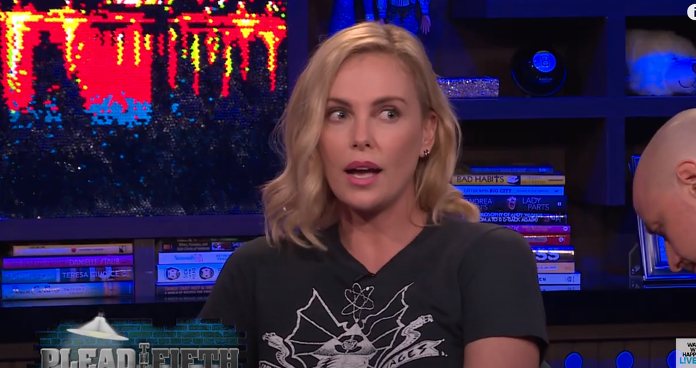 14 Celeb Feuds That Were SO One-Sided, They Were Basically Beefing With A Brick Wall 48 Person wearing a graphic T-shirt during an interview on a talk show set with bookshelves in the background