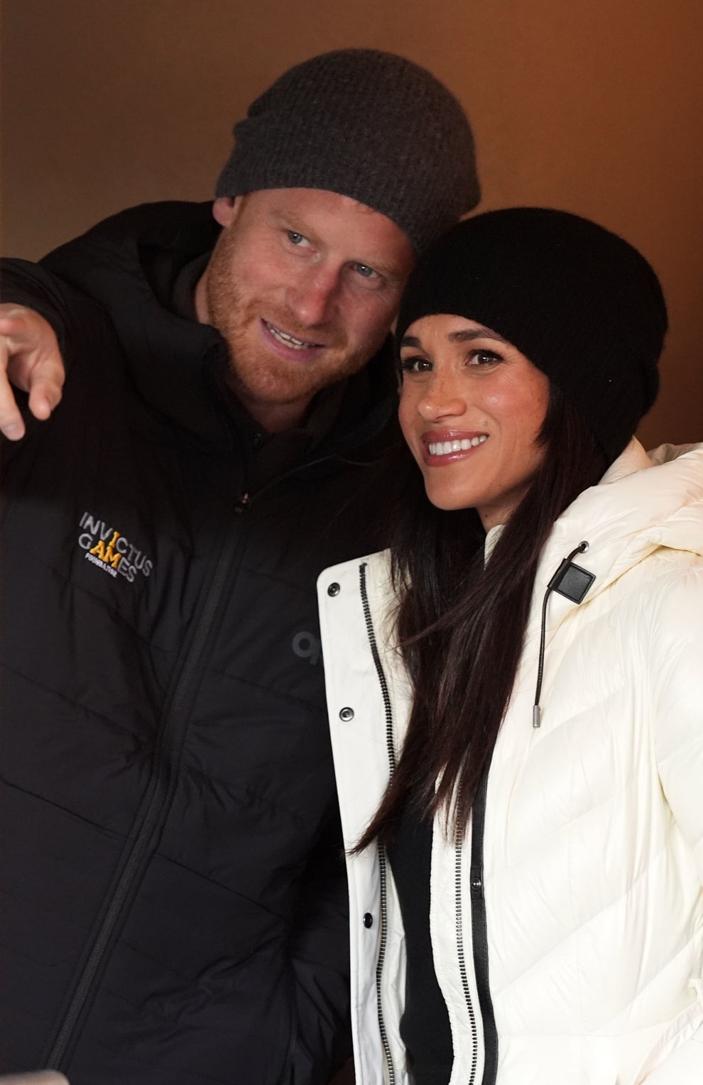 14 Celeb Feuds That Were SO One-Sided, They Were Basically Beefing With A Brick Wall 62 Two people in winter clothing, smiling. The man wears a beanie and a jacket with a logo. The woman wears a white puffer jacket and beanie