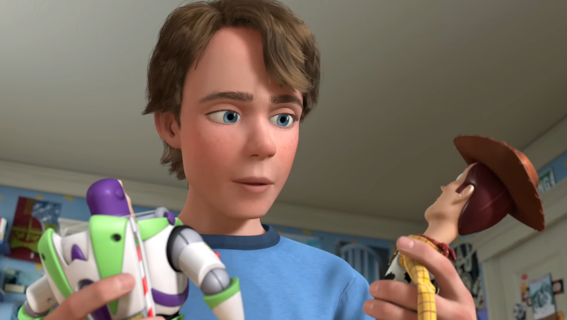 Young idiosyncratic   holds Buzz Lightyear and Woody toys portion    looking astatine  them thoughtfully
